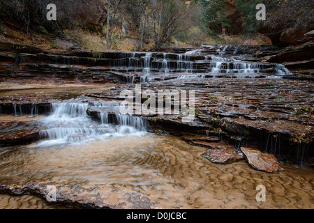 Waterfall cascades in Zion National Park on the Left Fork trail Stock Photo