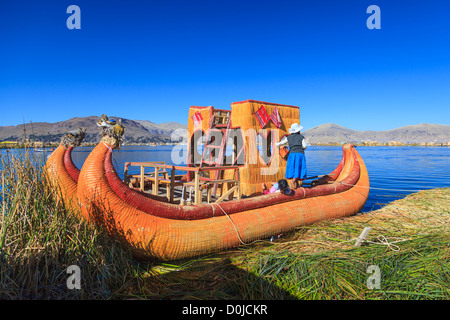 Traditional fishing boat on Uros floating islands, Lake Titicaca, Peru
