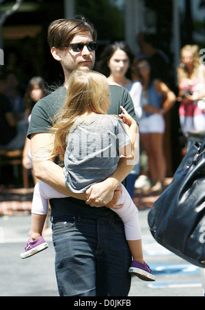 Tobey Maguire and his daughter Ruby Sweetheart Maguire, returning to their car after shopping at Fred Segal in West Hollywood Stock Photo