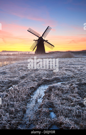 Dawn at Herringfleet Mill on a frosty winter's morning. Stock Photo