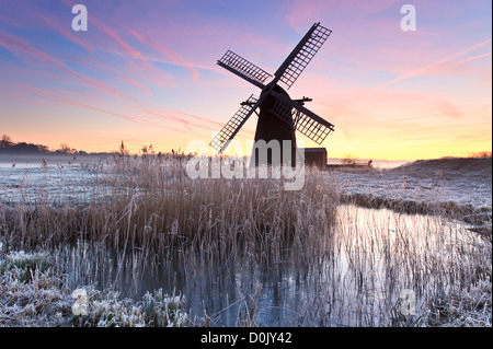 Dawn at Herringfleet Mill on a frosty winter's morning. Stock Photo