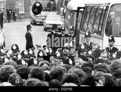 A Policemans helmet is thrown in the air at Grunwicks strike picket line 22/6/77 PIC DAVE BAGNALL. Grunwick dispute industrial action London Britain 1970s police policing Grunwick dispute picket line picketing trade union industrial action political politics 1970s 1977 working class Britain British Uk activists activist Stock Photo