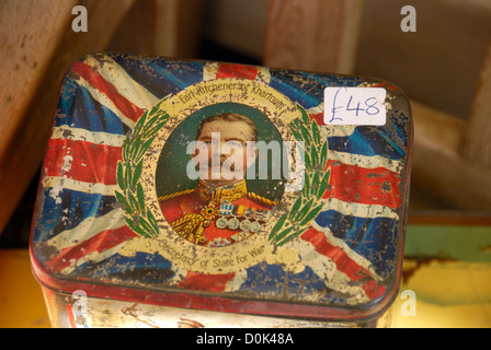Antique tin bearing an image of Lord Kitchener on a Union Jack background for sale in Portobello market. Stock Photo