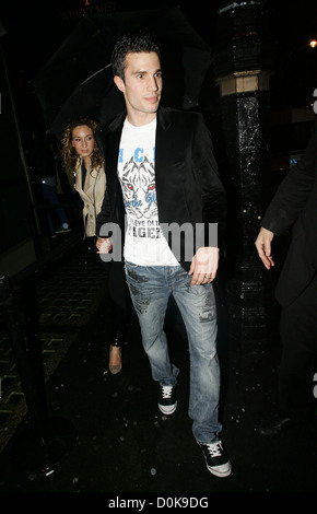 Footballer Robin van Persie of Arsenal and his wife Bouchra leaving Whisky Mist night club. London England Stock Photo