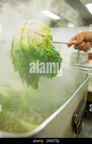 Cooking escarole Stock Photo