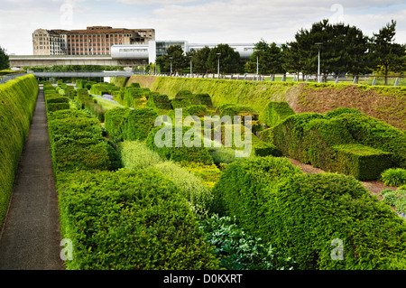 Overlooking the Thames Barrier Park with the derelict Millennium Mills and the Pontoon Dock DLR station in the background. Stock Photo