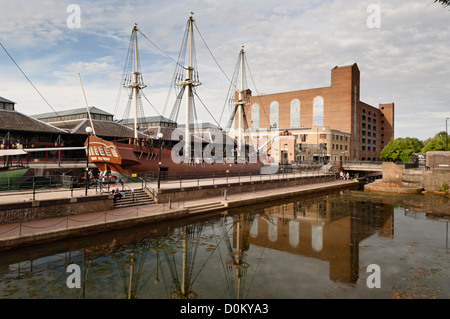 View of Tobacco Docks in Wapping with the replica of a tall ship called Three Sisters. Stock Photo