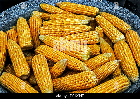 Corn boiled in a large pot, at a fair with traditional romanian food. Stock Photo