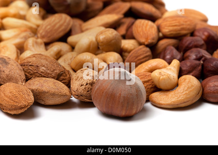 Mix of raw and roasted nuts. Cashews, hazelnuts and almonds Stock Photo