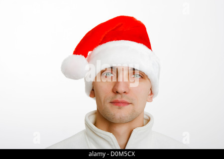 young man in a white jacket and Santa hat. portrait Stock Photo