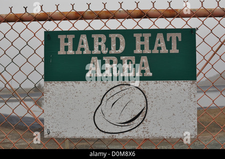 Hard Hat Area Sign with Pollution Background Stock Photo