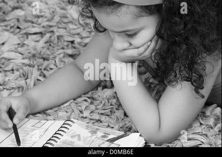 Close-up of a girl drawing a picture with crayons Stock Photo