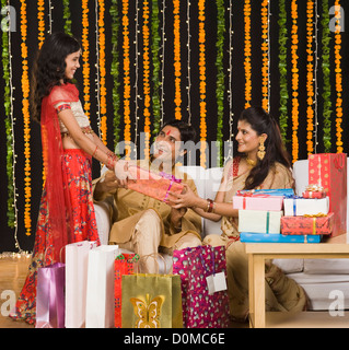 Couple giving gifts to their daughter on Diwali festival Stock Photo