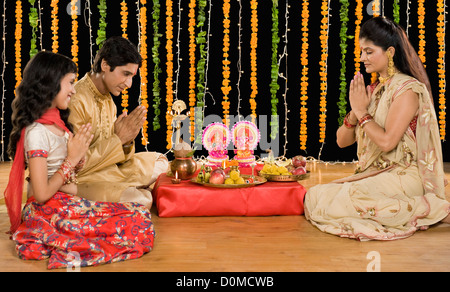 Family doing Diwali pooja Stock Photo