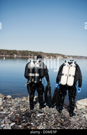 Two men preparing for diving Stock Photo