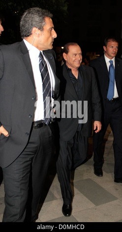 Italian Prime Minister Silvio Berlusconi leaving Gianni restaurant after attending the Serie A football match AC Milan