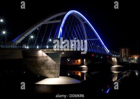 Lowry Avenue or County Highway 153 tied-arch steel bridge spanning Mississippi River in northeast Minneapolis Minnesota at night Stock Photo