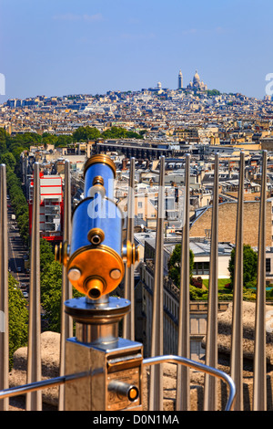 A telescope on the Arc de Triomphe in Paris with famous basilica of Sacre-Coeur in the background. Stock Photo