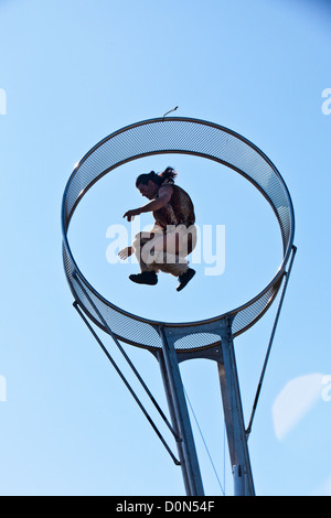 Aerialist from Studios De Cirque perform in the Wheel of Death in park at Great Yarmouth Stock Photo