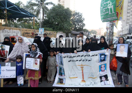 Relatives of missing persons are protesting against missing  of their loved ones and demanding for their recovery during a demonstration arranged by  Defense of Human Rights Pakistan, at Karachi press club on Wednesday, November 28, 2012.
