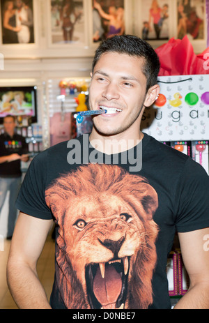 Alex Meraz The Twilight Wolf Pack bite into something sweet at Sugar Factory at Miracle Mile shops at Planet Hollywood Resort Stock Photo