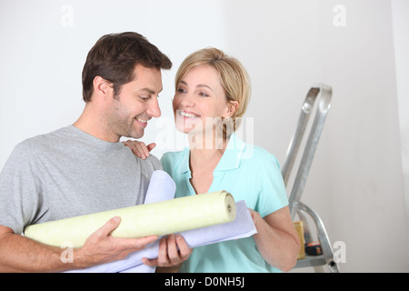 couple repainting their apartment Stock Photo