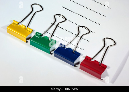 Coloured Bulldog Clips on Paper Stock Photo