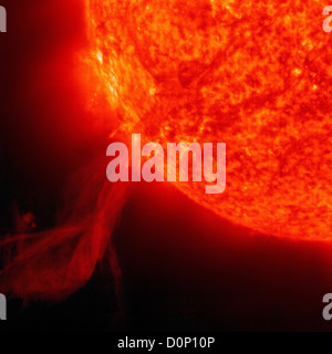 The Solar Heliospheric Observatory (SOHO) observed huge eruptive prominence arching out Sun.  It was captured it in extreme Stock Photo