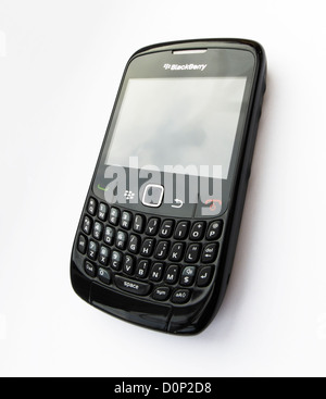 cutout of a black blackberry curve bold  keypad mini keyboard smart phone isolated on white background Stock Photo