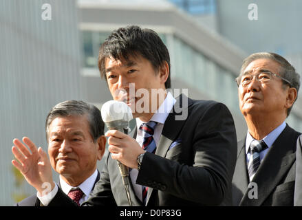 November 29, 2012, Tokyo, Japan - Mayor Toru Hashimoto of Osaka gives a pep talk to Naoki Inose during his street campaign in Tokyo on Thursday, November 29, 2012, for an election of the governor of the nation's capital. Standing at right is Shintaro Ishihara, who has resigned the governor's post in October to run in a general election set for December 16, the same day Tokyoites will pick up Ishihara's successor.  (Photo by Natsuki Sakai/AFLO) Stock Photo