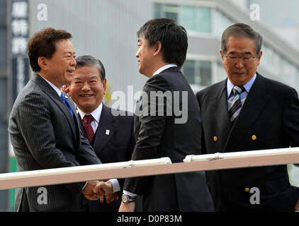 November 29, 2012, Tokyo, Japan - Mayor Toru Hashimoto of Osaka shakes hands with Naoki Inose, left, during his street campaign in Tokyo on Thursday, November 29, 2012, for an election of the governor of the nation's capital. Standing at right is Shintaro Ishihara, who has resigned the governor's post in October to run in a general election set for December 16, the same day Tokyoites will pick up Ishihara's successor.  (Photo by Natsuki Sakai/AFLO) Stock Photo