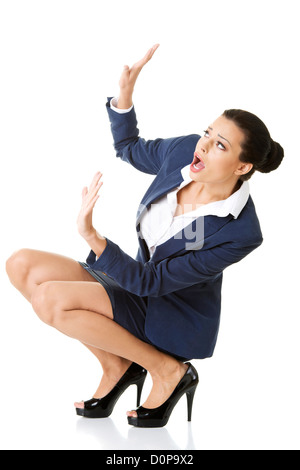 Scared businesswoman defending herself, isolated on white background Stock Photo