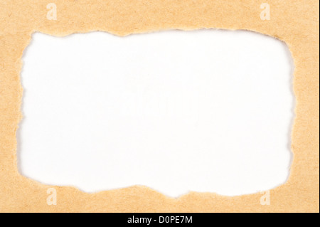 Torn yellow paper revealing white paper behind it Stock Photo