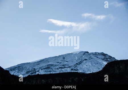 MOUNT KILIMANJARO, Tanzania — Mt Kilimanjaro's snow covered peak as seen in the morning from Moir Hut Camp (13,660 feet) on Mt Kilimanjaro's Lemosho Route. Stock Photo