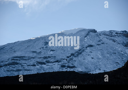 MOUNT KILIMANJARO, Tanzania — Mt Kilimanjaro's snow covered peak as seen in the morning from Moir Hut Camp (13,660 feet) on Mt Kilimanjaro's Lemosho Route. Stock Photo