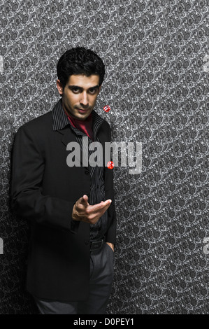 Portrait of a man throwing dices Stock Photo