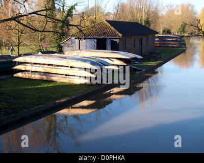 Boathouse and punts on the river bank, Cambridge, UK Stock Photo