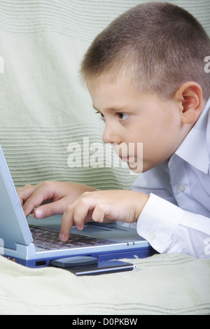 Boy working on laptop Stock Photo