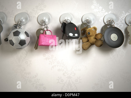Keys, key rings, wall, football, hand bag, teddy bear, vinyl record, Stock Photo