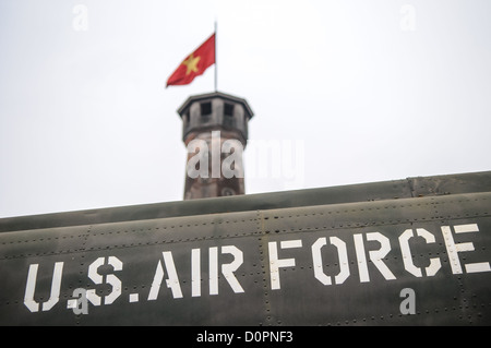 HANOI, Vietnam — A captured U.S. Air Force aircraft is displayed among other military equipment in the outdoor exhibition area of the Vietnam Military History Museum near the Flag Tower. The museum's collection includes various captured military hardware from the Vietnam War period. This display of war materiel stands as a testament to the conflict's scope and scale. Stock Photo