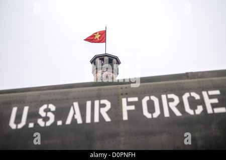 HANOI, Vietnam — A captured U.S. Air Force aircraft is displayed among other military equipment in the outdoor exhibition area of the Vietnam Military History Museum near the Flag Tower. The museum's collection includes various captured military hardware from the Vietnam War period. This display of war materiel stands as a testament to the conflict's scope and scale. Stock Photo