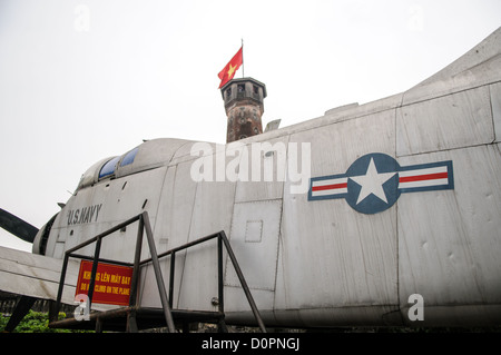 HANOI, Vietnam — A collection of captured U.S. military aircraft, including helicopters and planes, is displayed in the outdoor exhibition area of the Vietnam Military History Museum. These aircraft form part of the museum's extensive collection of military equipment from the Vietnam War period. The display showcases various types of American military aviation equipment captured during the conflict. Stock Photo