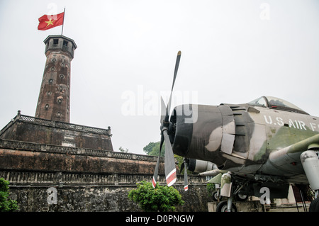 HANOI, Vietnam — A captured U.S. Air Force aircraft is displayed among other military equipment in the outdoor exhibition area of the Vietnam Military History Museum near the Flag Tower. The museum's collection includes various captured military hardware from the Vietnam War period. This display of war materiel stands as a testament to the conflict's scope and scale. Stock Photo