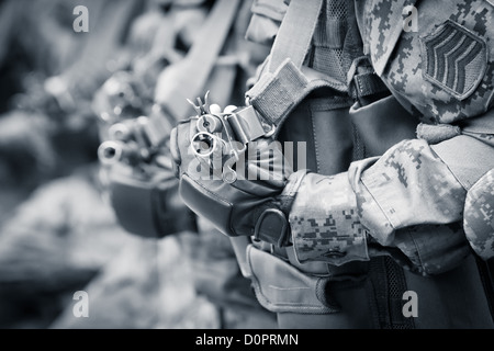 Soldiers ready for combat with assault rifles Stock Photo
