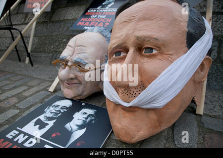 29th November 2012. London UK. Caricature heads of  Rupert Murdoch and Prime Minister David Cameron outside the Queen Elizabeth II centre. The findings of the Leveson inquiry makes recommendations on the practices and ethics of the press following an 18 month inquiry. Credit:  amer ghazzal / Alamy Live News