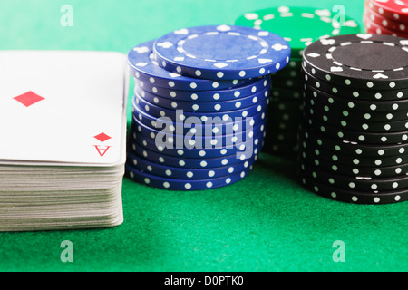Poker chips and deck Stock Photo