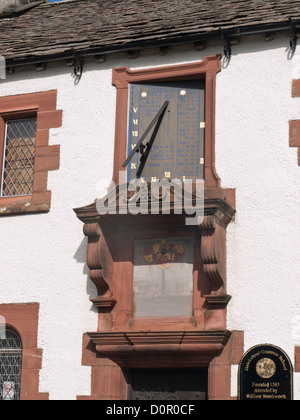 Hawkshead village in the Lake district England UK, i, sundial on the old grammar school attended by Stock Photo