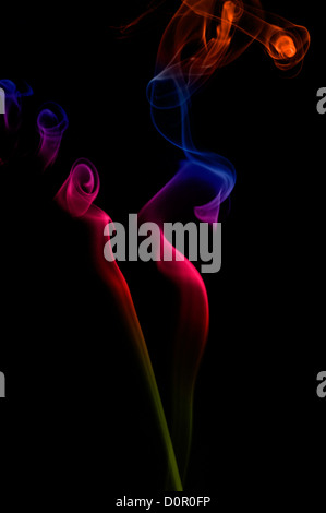 Coloured smoke against a black background Stock Photo