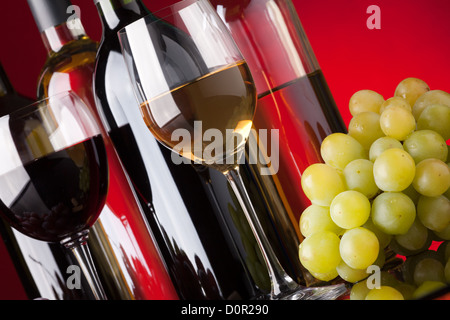 Bottles, glasses and grapes Stock Photo