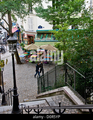 Cafe culture tables alfresco sidewalk pavement street scene Montmartre Paris France Europe Stock Photo